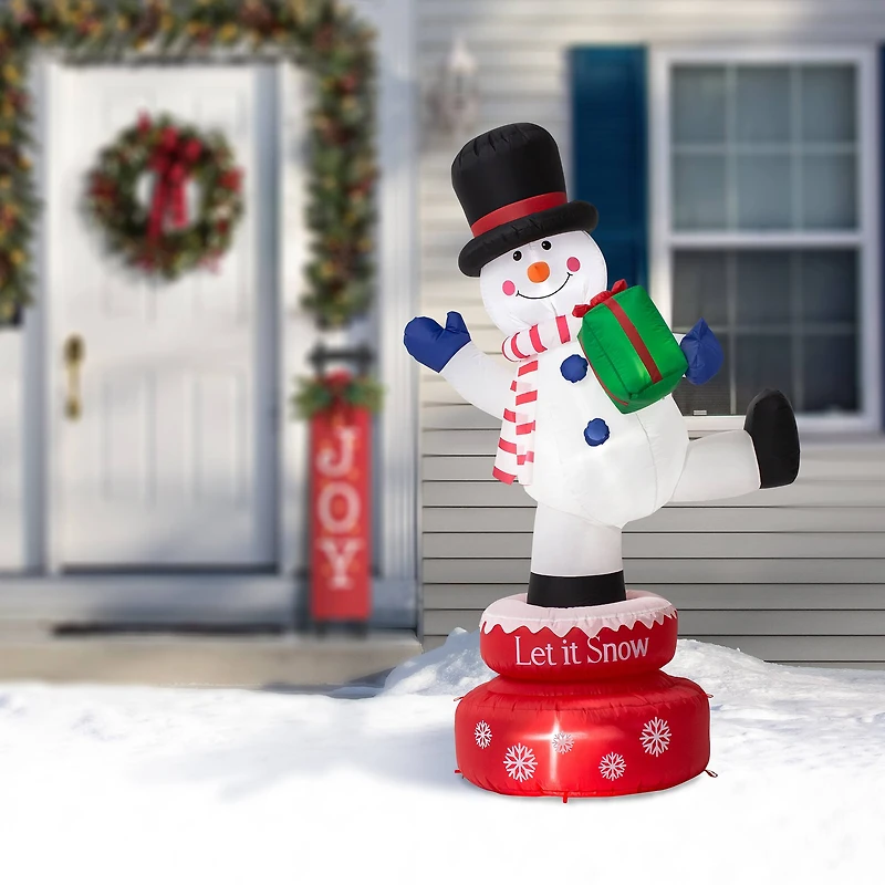 Glitzhome® 6ft. Lighted Inflatable Rotating Snowman Décor