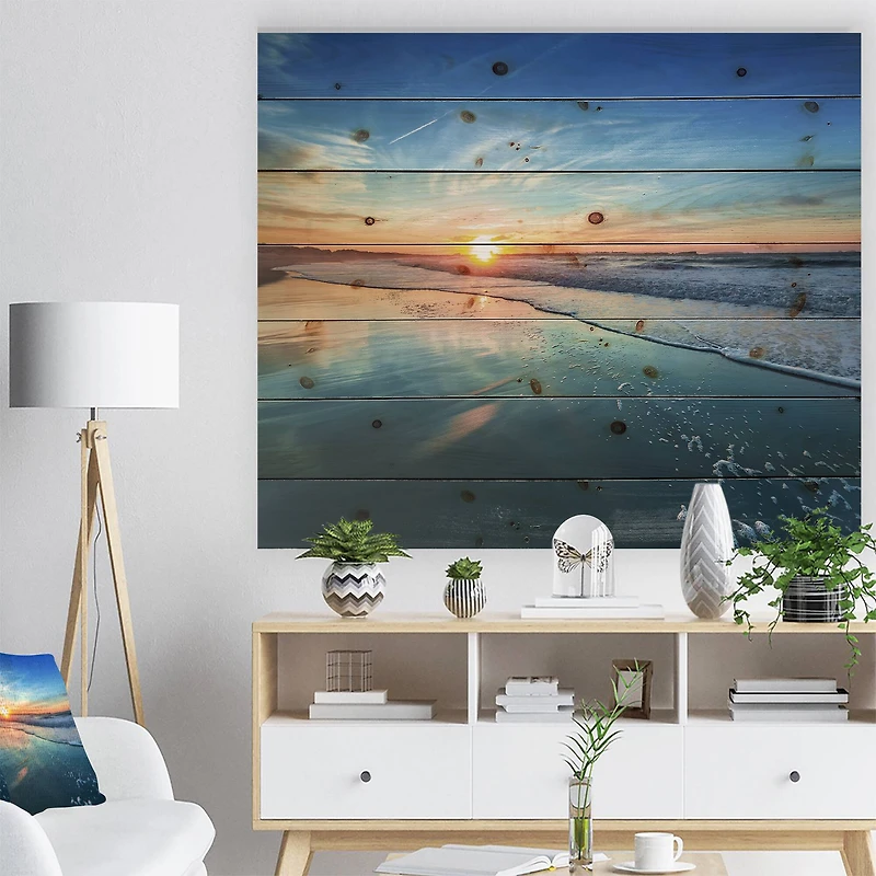 Designart - Blue Seashore with Distant Sunset