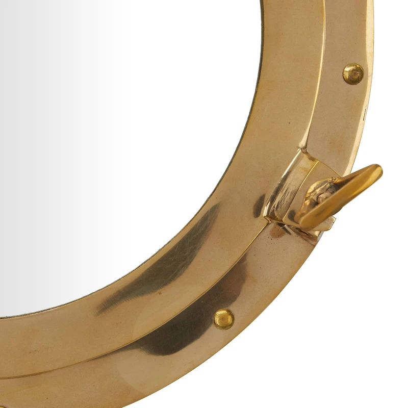 The Novogratz Gold Brass Sail Boat Wall Mirror with Port Hole Detailing 15" x 3" x 15"