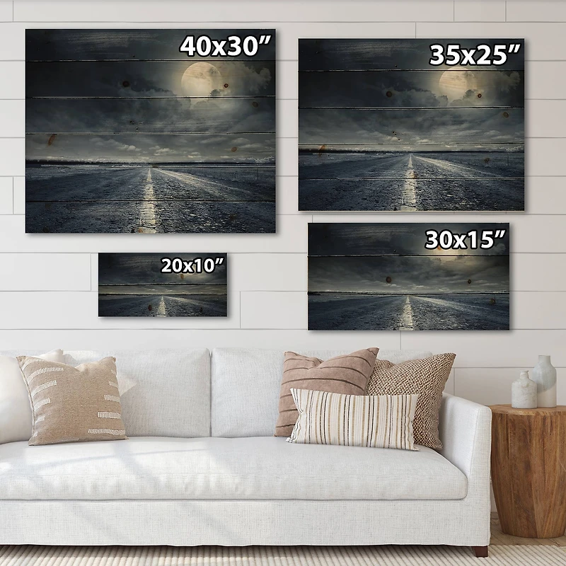 Designart - Asphalt Road Under Cloudy Full Moon I