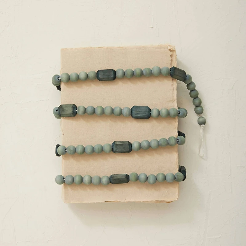 Hello Honey® 6ft. Gray Paulownia Wood Beads Garland