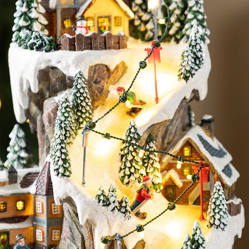 Glitzhome® 15.5" Lighted Christmas Skiing Moutain Resin Village with Movement and Music