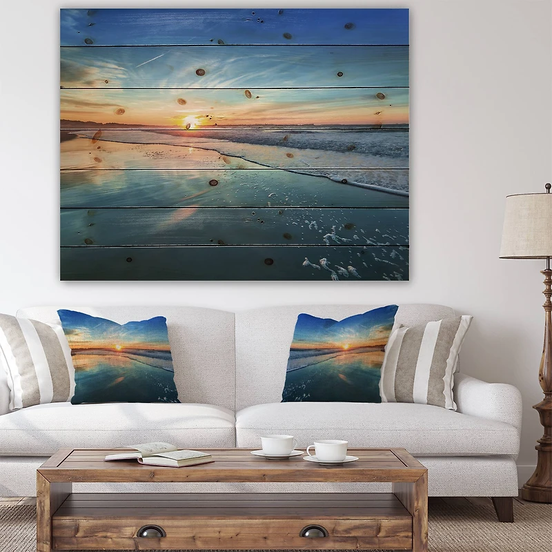 Designart - Blue Seashore with Distant Sunset