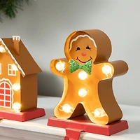 Glitzhome® Marquee LED Gingerbread House & Gingerbread Man Christmas Stocking Holder Set