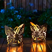 Glitzhome® 9" Metal Flying Butterfly Silhouette Solar Powdered Edison Bulb Outdoor Lanterns, 2ct.