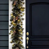 9' x 10" Pre-lit Glitter Artificial Christmas Pine Garland with Cones, Snowflakes and 100 Clear Lights