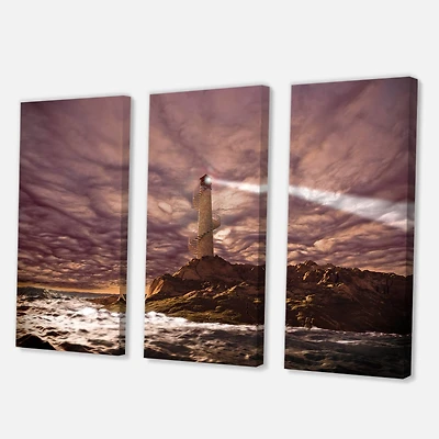 Designart - Lighthouse Shining Light During Stormy Night I