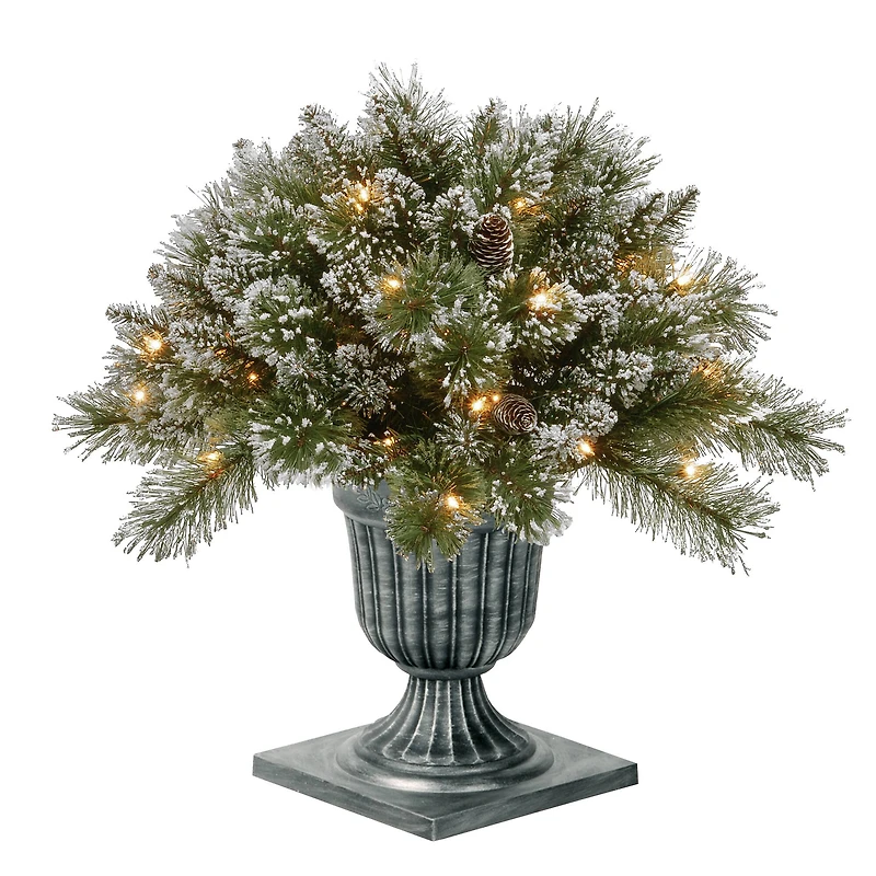 24" Glittery Bristle® Pine Porch Bush in Dark Bronze Plastic Urn with White Tipped Cones