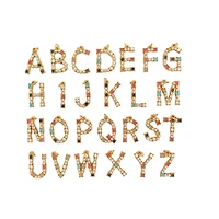 Blue Moon Studio™ Gold-Colored Alphabet Stone Charm Set