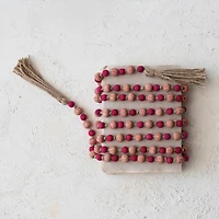 Hello Honey® 12ft. Pink & Red Paulownia Wood Beads with Jute Tassels Garland