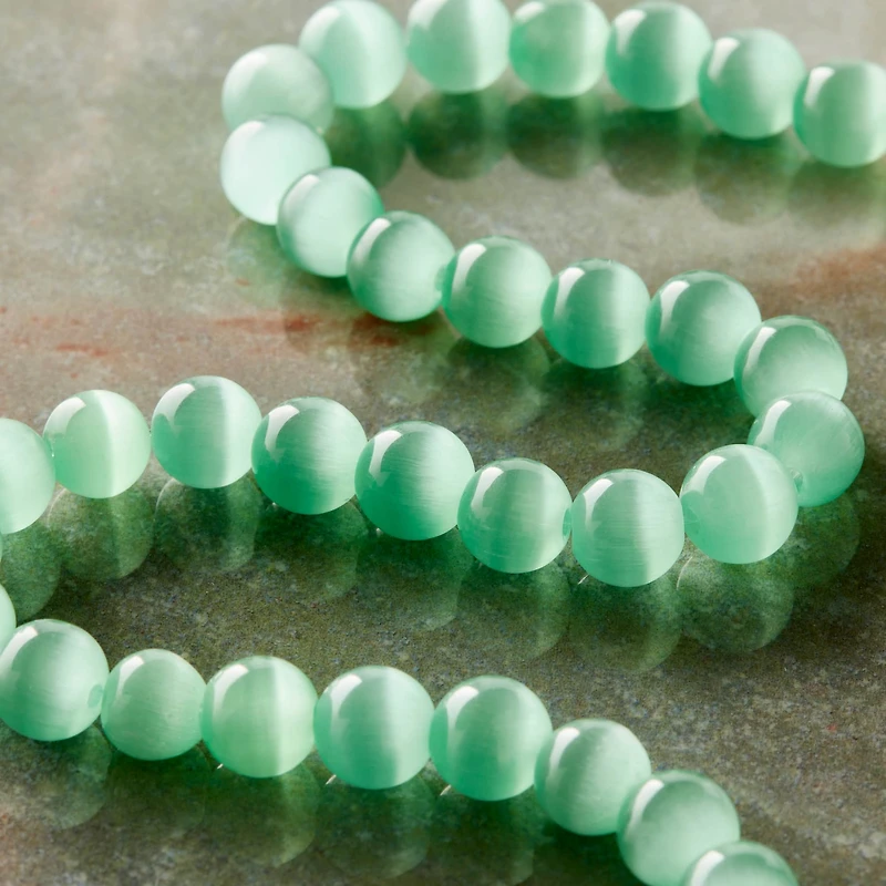 12 Pack: Aqua Cat Eye Glass Round Beads, 8mm by Bead Landing™