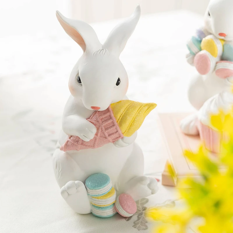 Glitzhome® Set of 2 Easter Resin Bunny Holding Macaron Table Decor