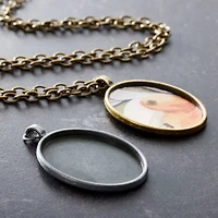 Found Objects™ Silver & Gold Oval Frame Pendants by Bead Landing™