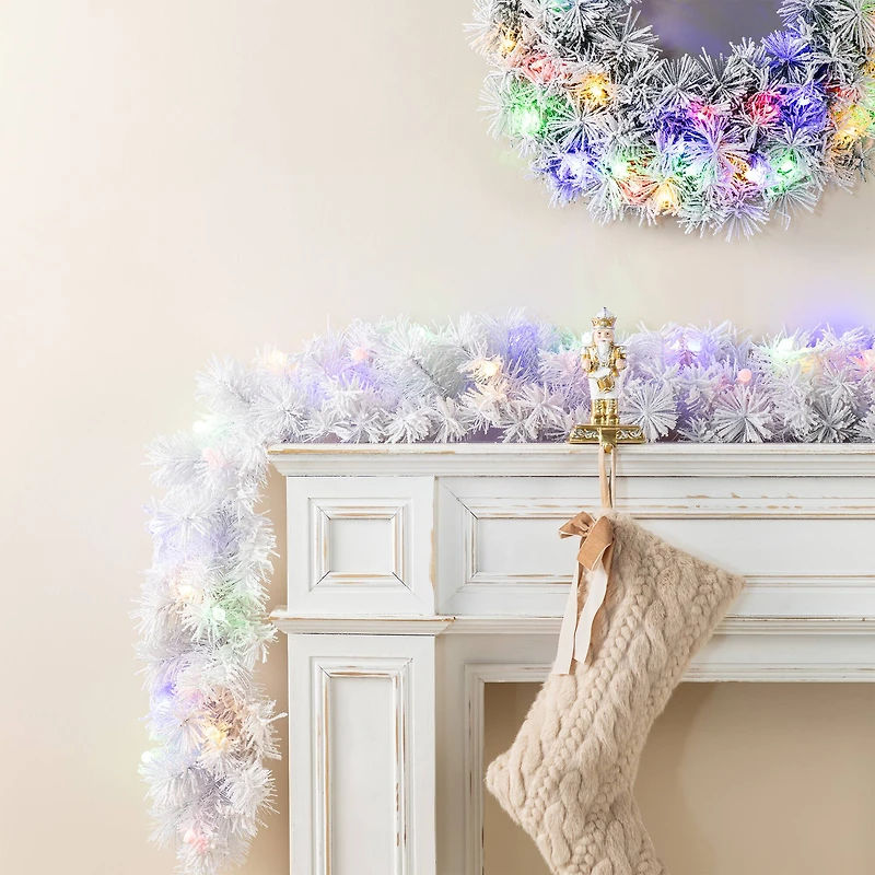 Glitzhome® 6ft Pre-Lit Snow Flocked White Pine Christmas Garland with Timer, 2ct.