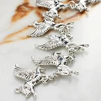 12 Packs: 6 ct. (72 total) Rhodium Metal Unicorn Charms, 23mm by Bead Landing™