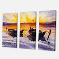 Designart - Sunset and Two Small Boats Parking On The Shore