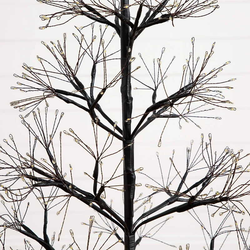 4ft. Pre-Lit Artificial Halloween Black Starburst Tree with 800 Fairy Warm White LED Lights