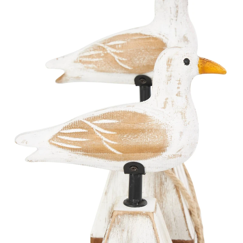 Brown Bird Sculpture with White Distressed Buoy Posts Set