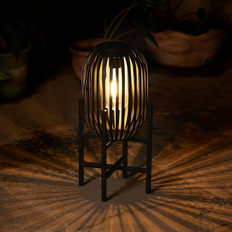 Glitzhome® 14.25" Black Slim Metal Stripes Solar Powered Edison Bulb Outdoor Lantern