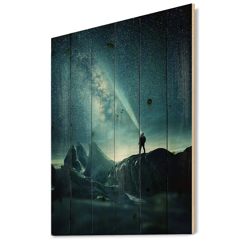 Designart - A Man Shining A Light Into The Night Sky - Modern Print on Natural Pine Wood