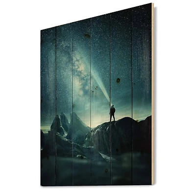 Designart - A Man Shining A Light Into The Night Sky - Modern Print on Natural Pine Wood