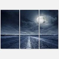 Designart - Asphalt Road Under Cloudy Full Moon I