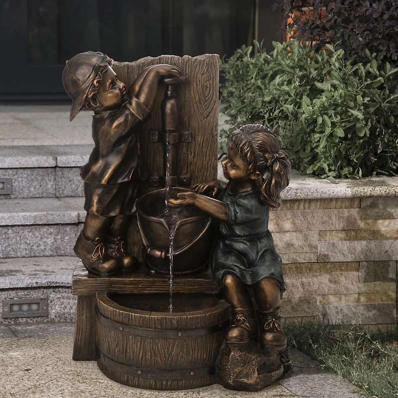 Glitzhome® 25" Polyresin Boy and Girl Sculptural Outdoor Fountain