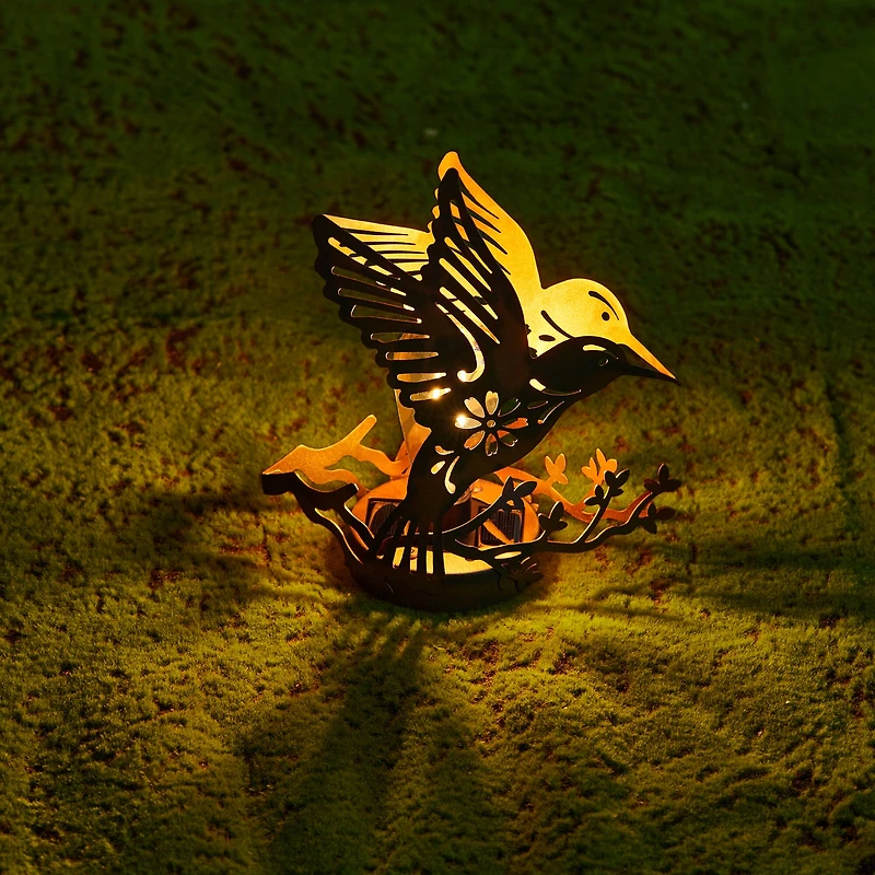 Glitzhome® 9.75" Metal Flying Hummingbird Silhouette Solar Powered Edison Bulb Outdoor Lanterns, 2ct.