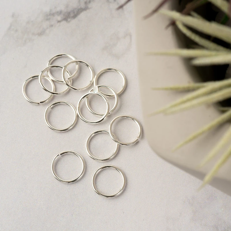 6 Packs: 12 ct. (72 total) 10mm Sterling Silver Jump Rings by Bead Landing™