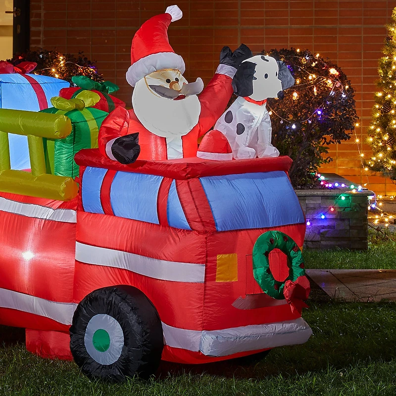 Glitzhome® 7ft. Inflatable Santa in Truck With Lights