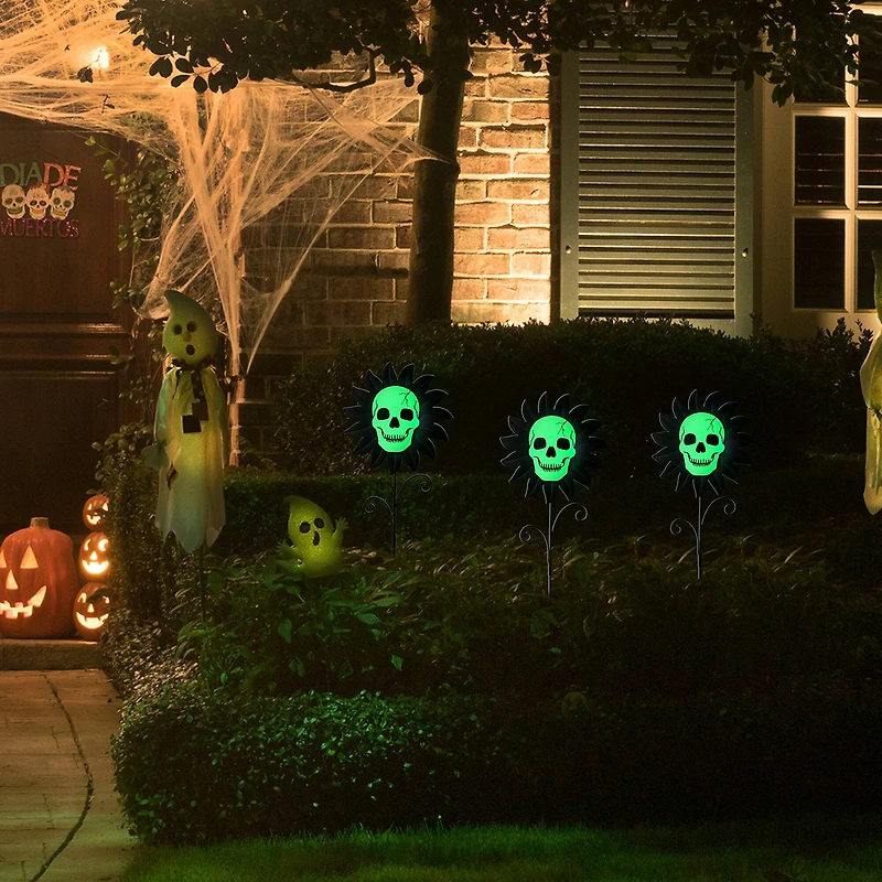 Glitzhome® 24" Halloween Metal Sunflower Skulls Glow-in-Dark Yard Stakes, 3ct.