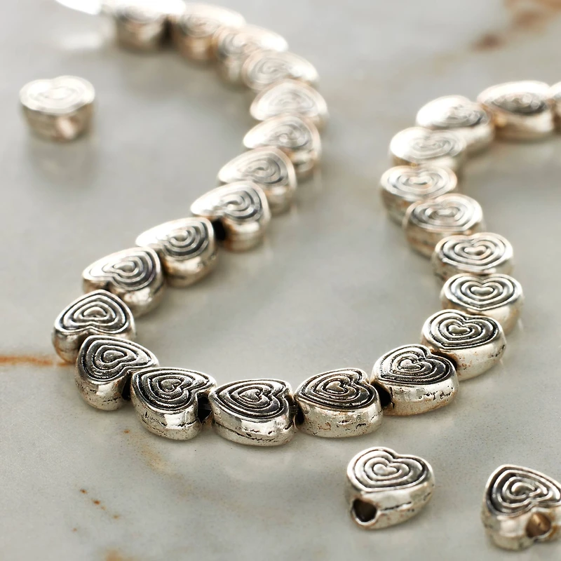 12 Pack: Silver Plated Carved Heart Beads, 6mm by Bead Landing™