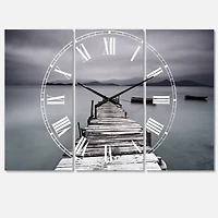 Designart 'Pier And Boats At Seashore Beach Style Multipanel Wall Clock