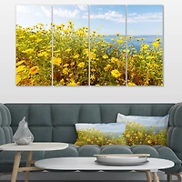 Designart - Little Yellow Flowers over Seashore