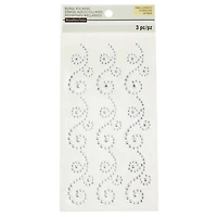 12 Packs: 3 ct. (36 total) Clear Flourish Adhesive Rhinestones by Recollections™