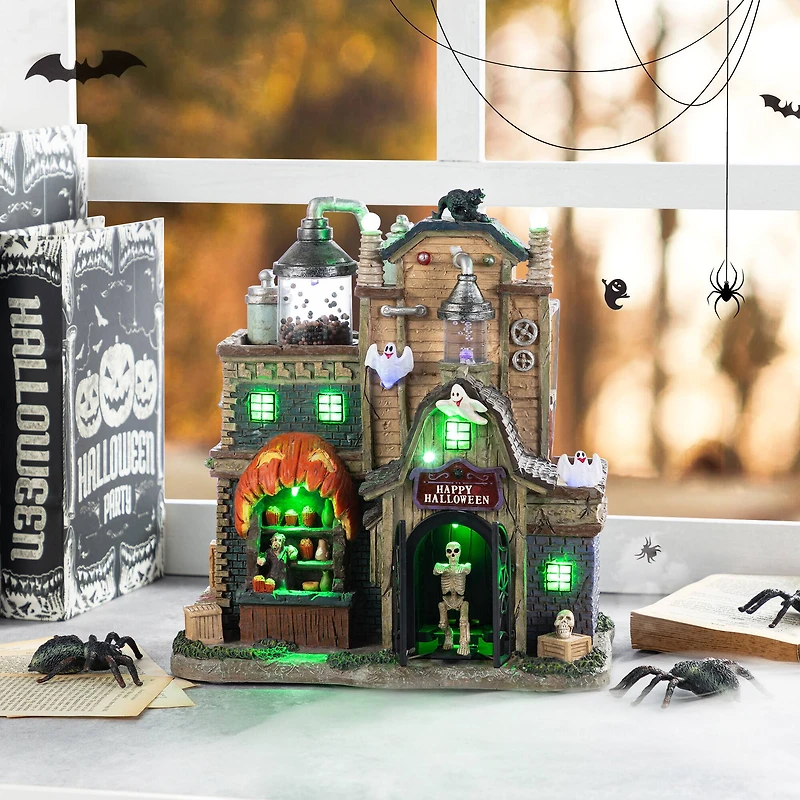 Glitzhome® 11"H Lighted Resin Halloween Haunted House Village