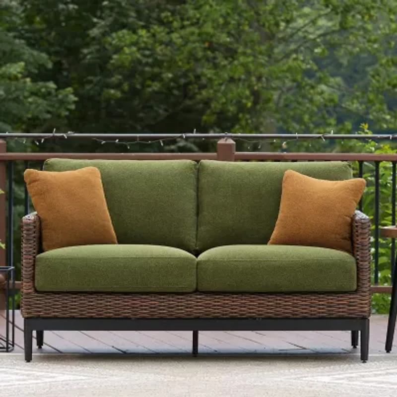 Signature Design by Ashley Hoquiam Outdoor Loveseat with Cushion