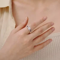 Diamonart Womens Cubic Zirconia Sterling Silver Round Crossover Side Stone Promise Ring