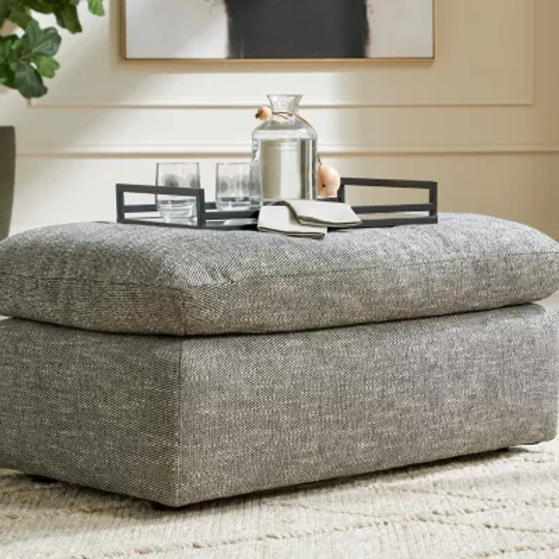 Signature Design by Ashley® Dramatic Cushioned Upholstered Ottoman