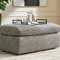 Signature Design by Ashley® Dramatic Cushioned Upholstered Ottoman