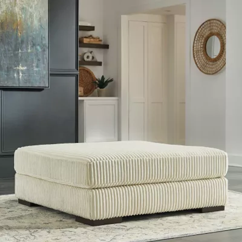 Signature Design by Ashley® Lindyn Cushioned Upholstered Ottoman