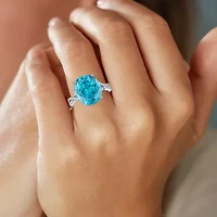 Womens Genuine Blue Topaz Sterling Silver Oval Side Stone Cocktail Ring