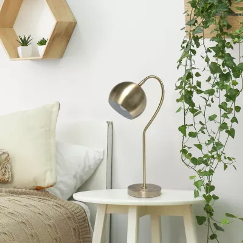 All the Rages Lalia Home Mid Century Curved  With Dome Shade; Antique Brass Metal Table Lamp