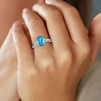 Womens Genuine Blue Topaz Sterling Silver Oval Side Stone Cocktail Ring