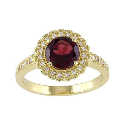 Genuine Garnet and 1/7 CT. T.W. Diamond Ring