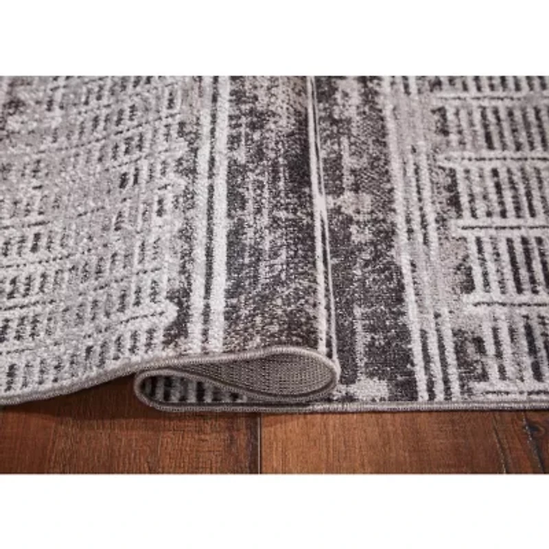 Signature Design by Ashley® Henchester Washable Indoor Rectangular Area Rug
