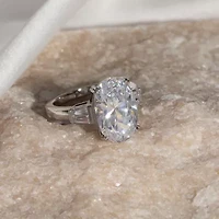 Diamonart Womens Cubic Zirconia Sterling Silver Oval Side Stone Engagement Ring