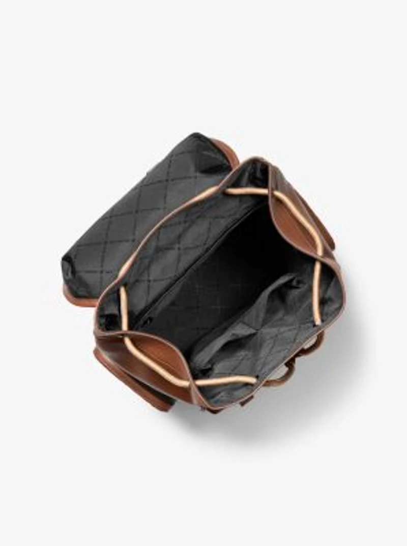 Jet Set Logo Embossed Pebbled Leather Backpack