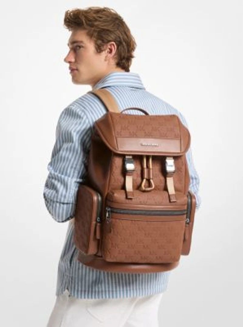 Jet Set Logo Embossed Pebbled Leather Backpack