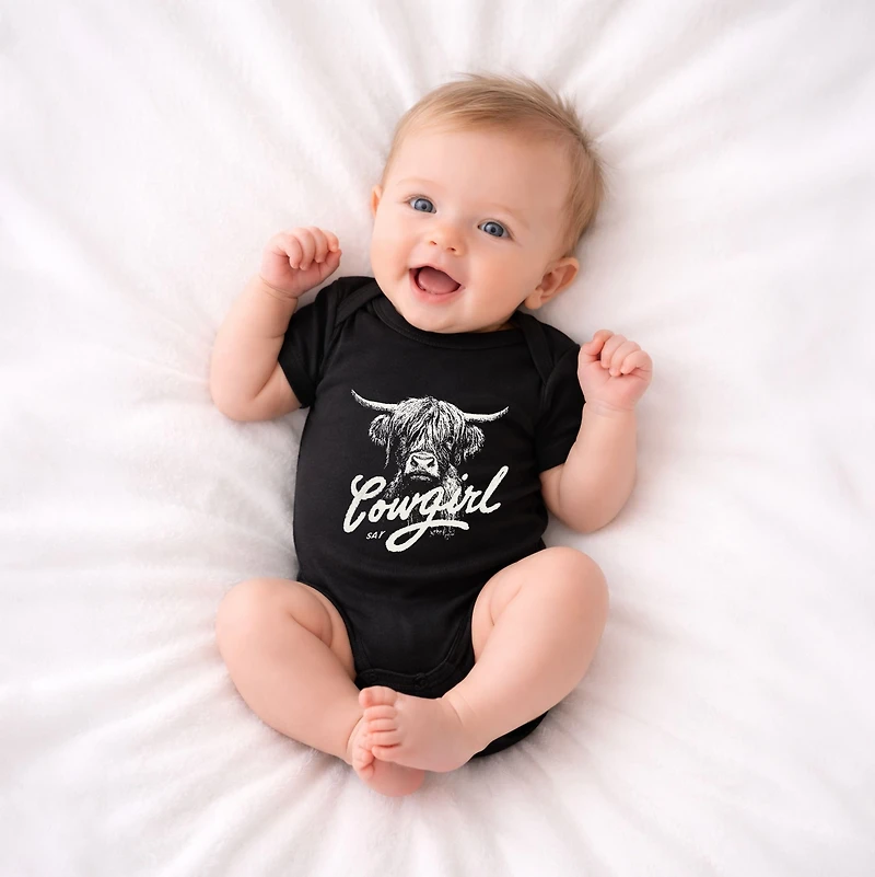 The Juniper Shop - Cowgirl Highland Cow Baby Short Sleeve Graphic Bodysuit